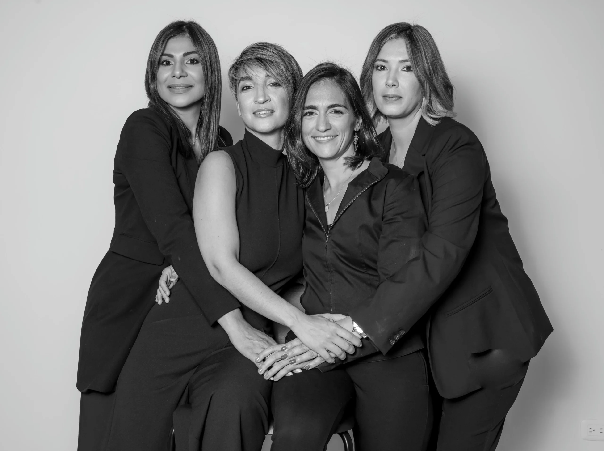 Photographer capturing a fashion model using studio flash lights and a beauty dish