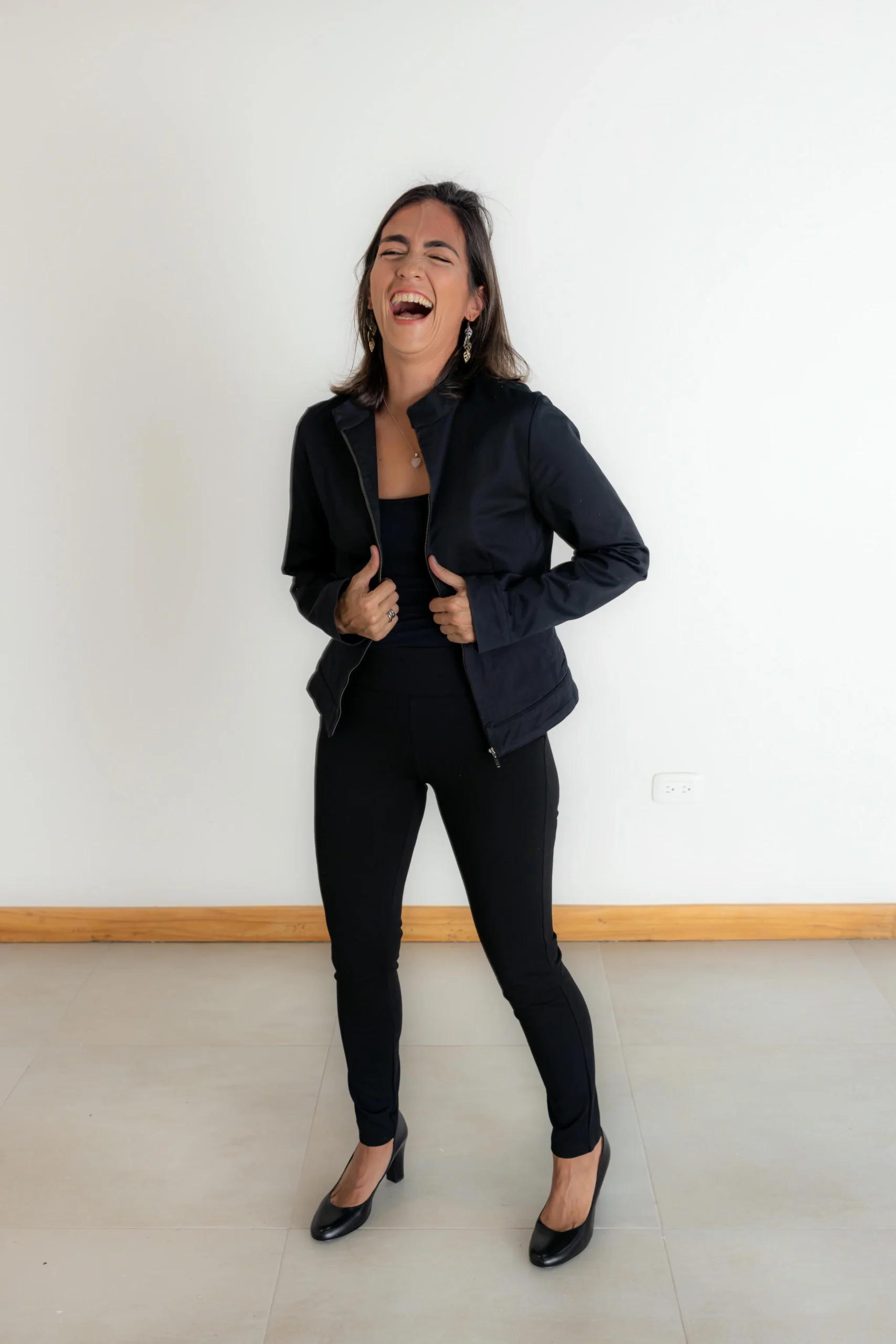 Photographer using a reflector to balance shadows in a studio photo session