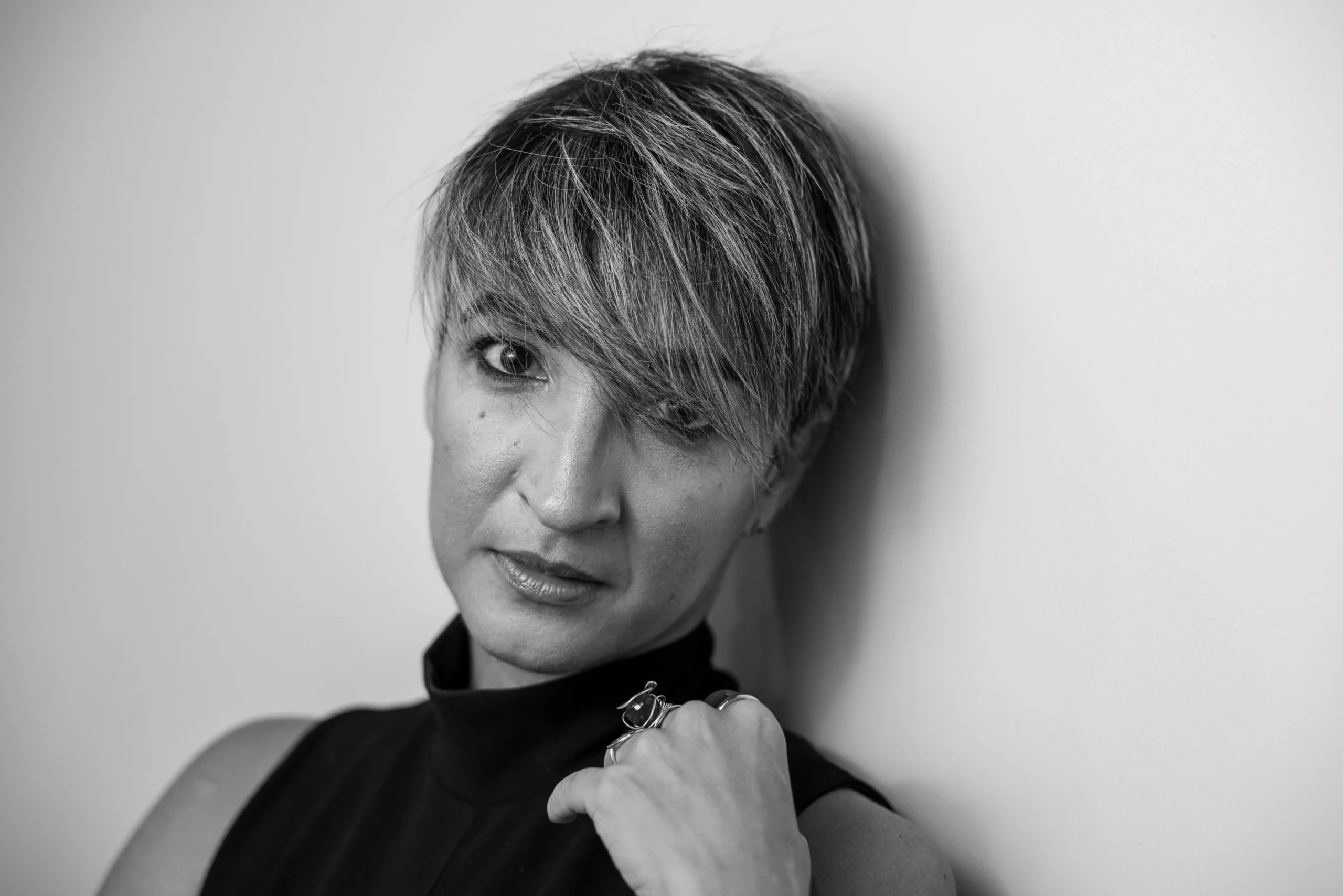 Professional photographer in Punta Cana adjusting studio flash lights for a portrait session