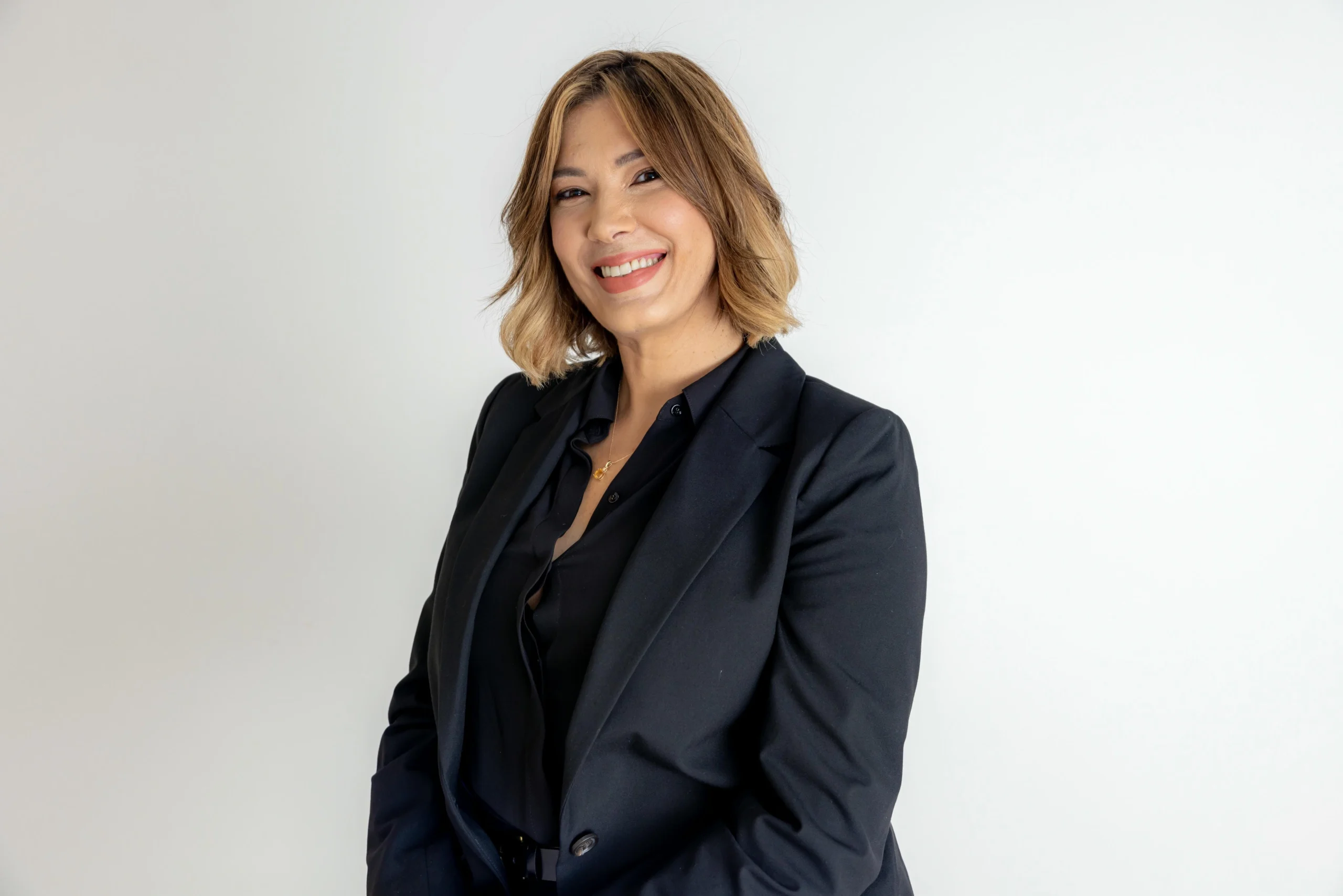 Photographer directing a model under controlled studio lighting conditions